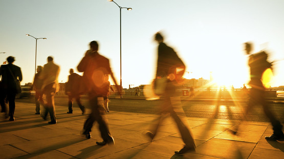 People walking at sunset